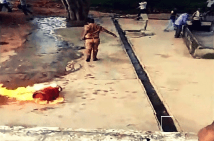 brave cop drags burning cylinder into pond