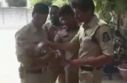 Hyderabad - Cops take care of baby while mother writes exam