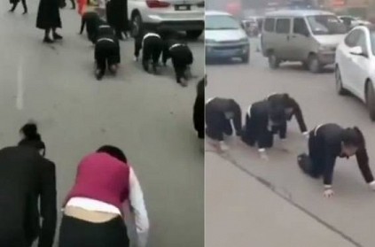 China - Employees forced to crawl on road for failing to meet targets